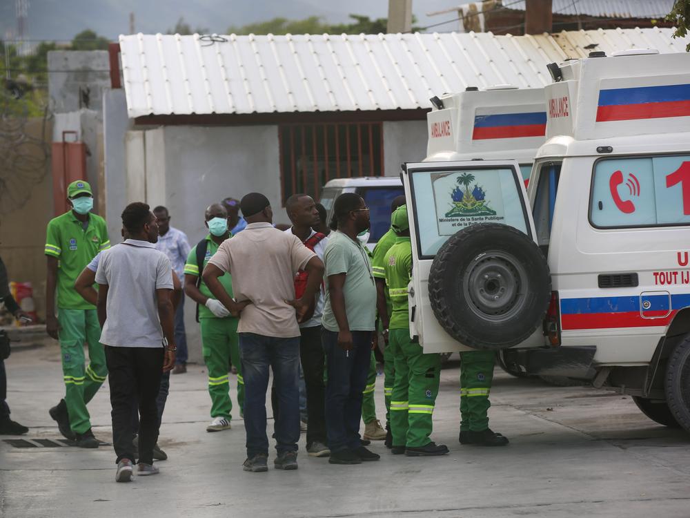 Medics inspect an ambulance of wounded people, shot by armed gangs at the General Hospital, in Port-au-Prince, Haiti.
