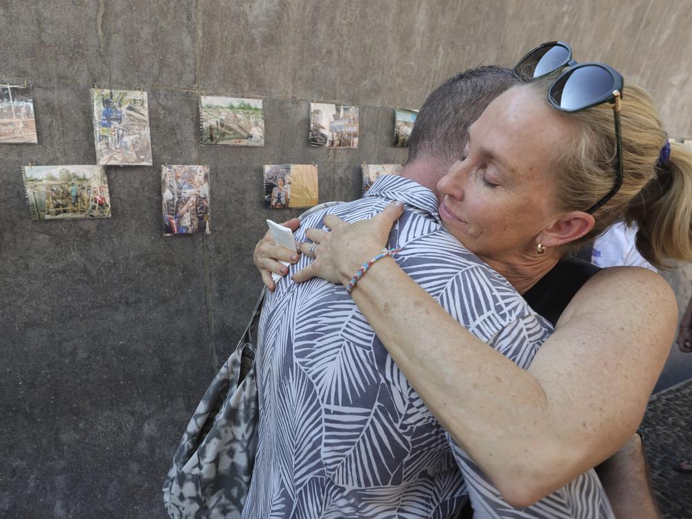 Relatives of a victim of the tsunami hug each other during its 20th anniversary at Tsunami Memorial Park at Ban Nam Khem in southern Thailand on Thursday.