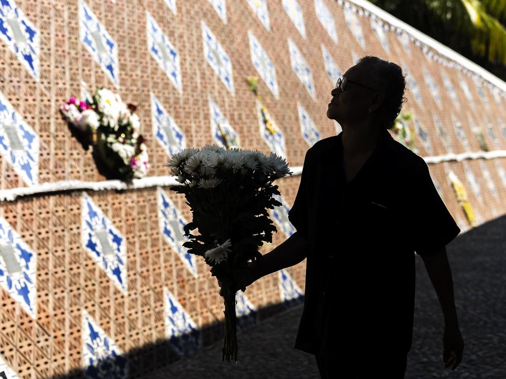 A relative of a victim of a 2004 Indian Ocean tsunami participates in its 20th anniversary at Tsunami Memorial Park at Ban Nam Khem, Takuapa district of Phang Nga province, southern Thailand, Thursday, Dec. 26, 2024.