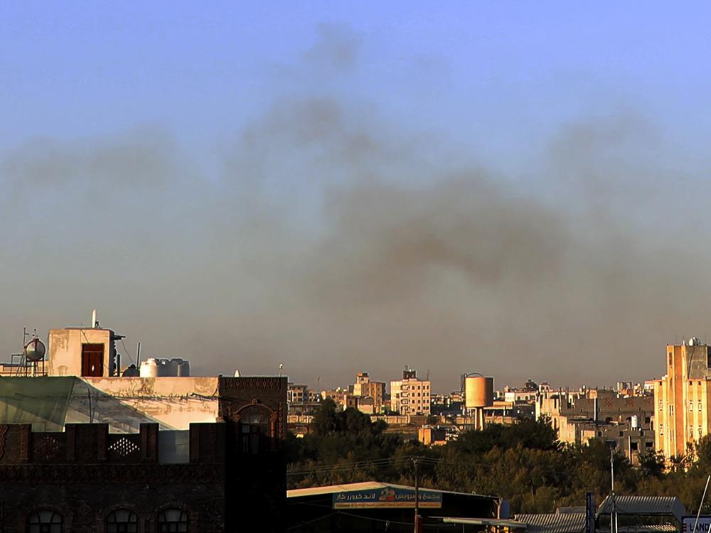 Smoke rises from the area around Yemen's Sanaa International Airport following an airstrike on Thursday. The Israeli military reported targeting infrastructure used by the Houthis at the airport, as well as a number of ports and power stations.