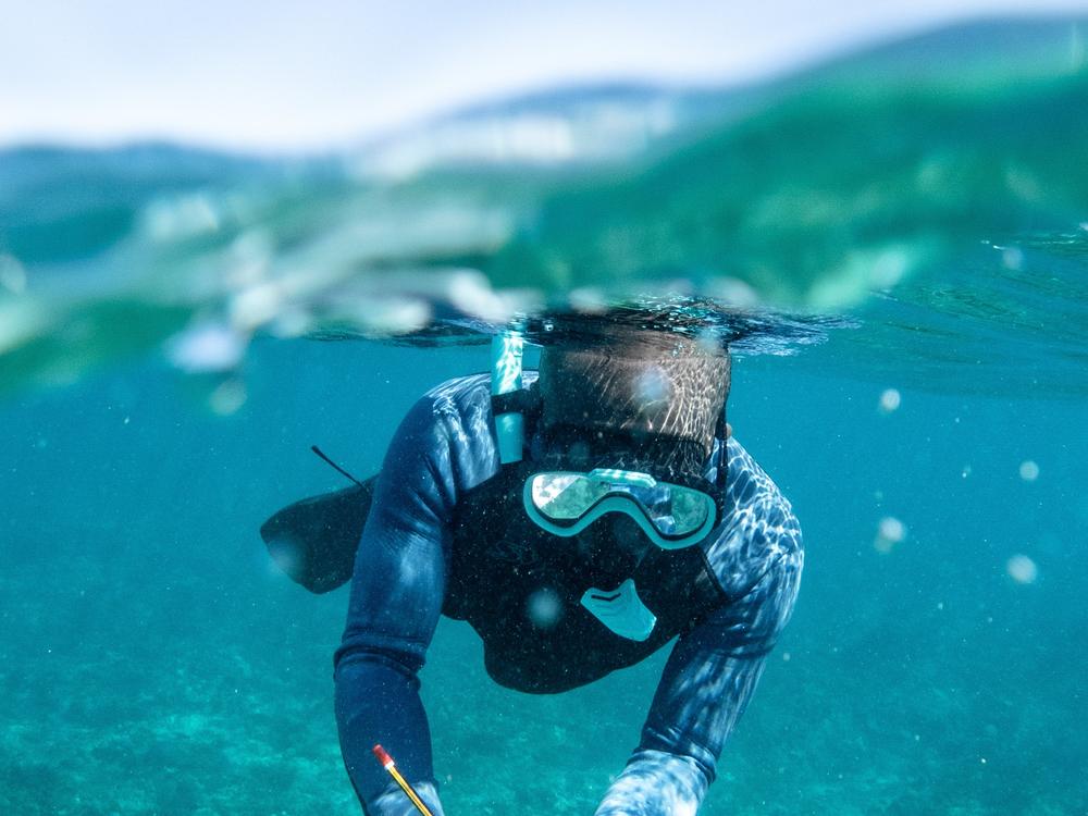 François Andrianomenjanahary collects marine data on a coral reef in the Barren Isles. The Vezo people are known for their diving skills, and can stay long minutes underwater.