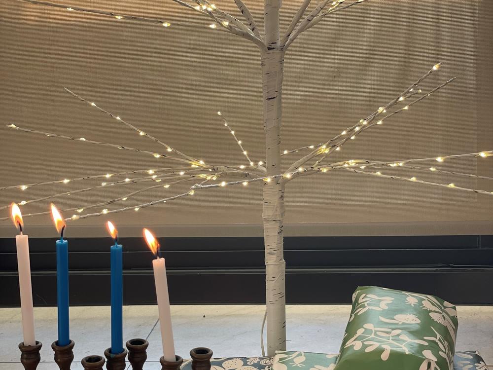 Scott Simon's Christmas tree and Hanukkah candles.