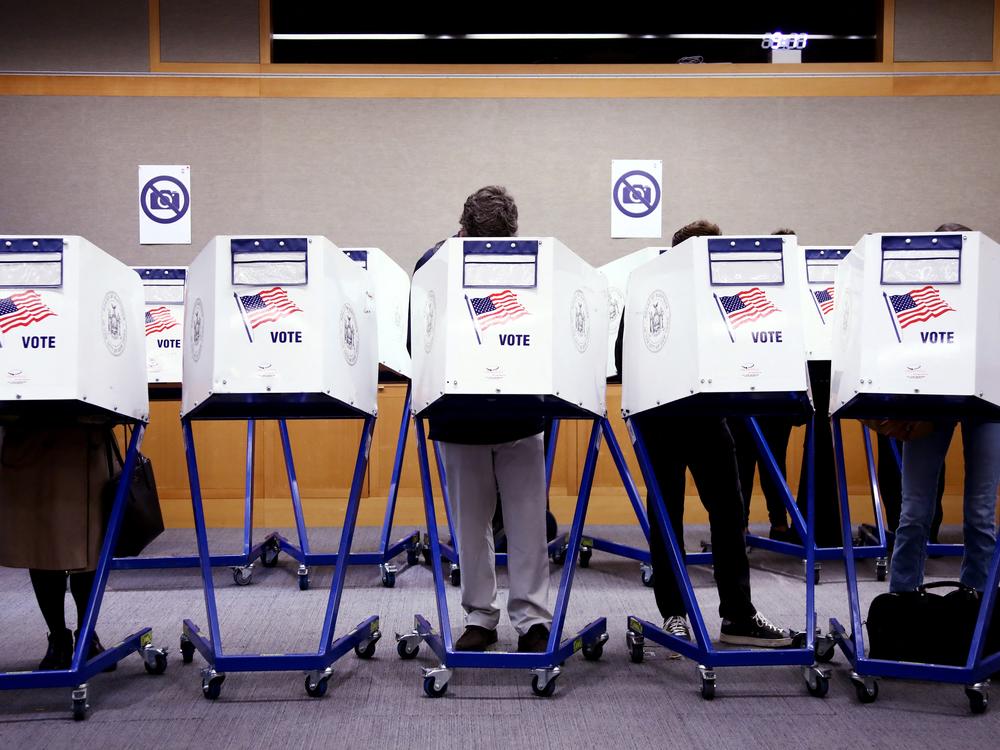 Voters fill out their ballots at a polling station in New York City on Election Day, Nov. 5.