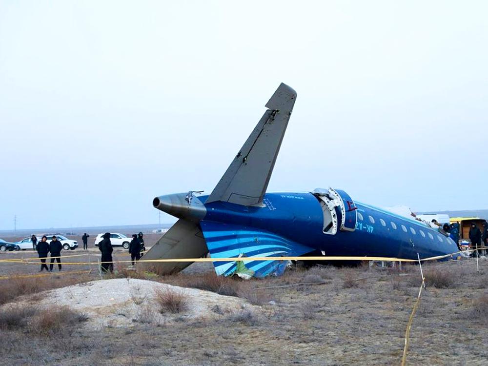 In this photo taken from a video released by the administration of Mangystau region, a part of Azerbaijan Airlines' Embraer 190 lies on the ground near the airport of Aktau, Kazakhstan, on Thursday.