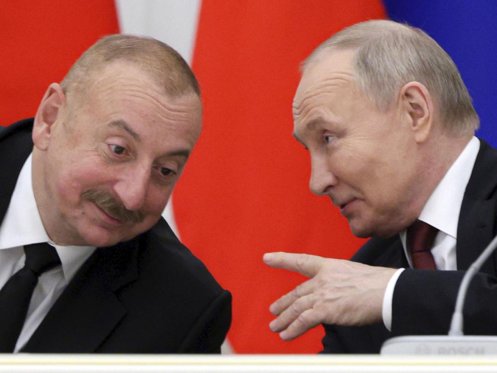 Russian President Vladimir Putin, right, and Azerbaijani President Ilham Aliyev attend a meeting with railway industry veterans and workers to mark the 50th anniversary of the Baikal-Amur Mainline (BAM) construction at the Kremlin in Moscow, Russia, Monday, April 22, 2024.