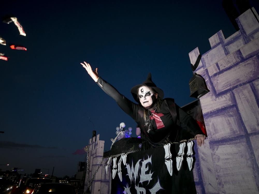 Kenny Violett launches candy towards crowds of costumed children from the Wizard's Chest's float in the annual Broadway Halloween Parade. Oct. 19. Full story <a href=
