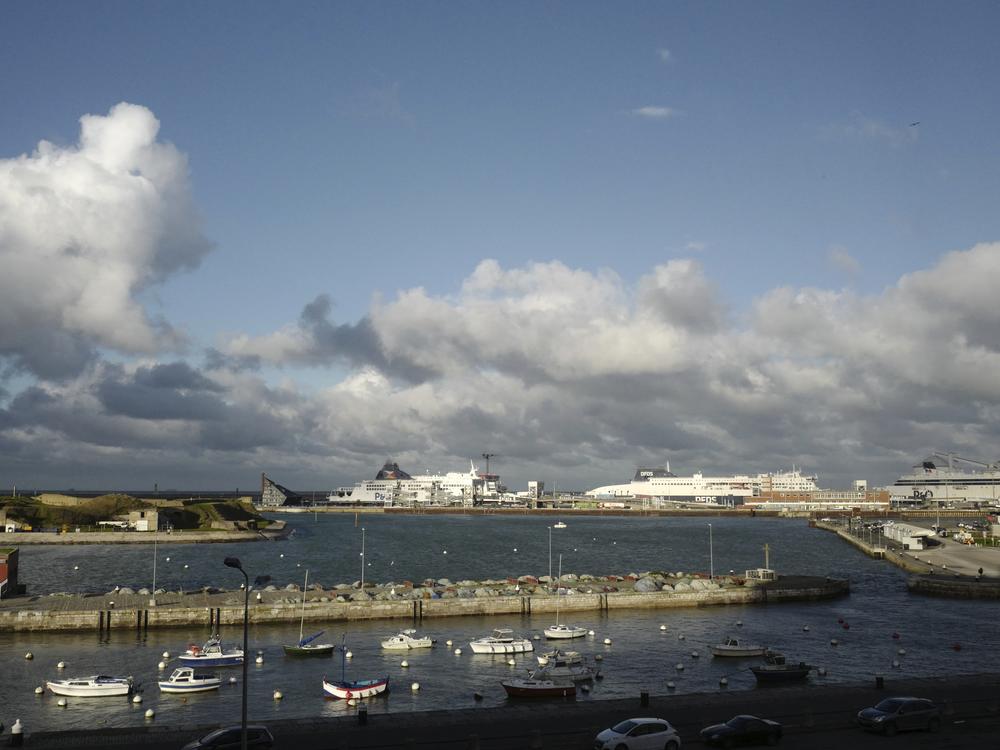 Ferries, background, dock in the port of Calais, northern France, in November 2021. At least 76 people have died crossing the English Channel in 2024, making it the deadliest year on record for small boat crossings.
