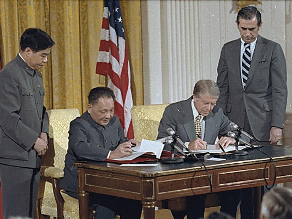 China's then-paramount leader Deng Xiaoping and President Jimmy Carter sign historic diplomatic agreements between the United States and China in 1979.