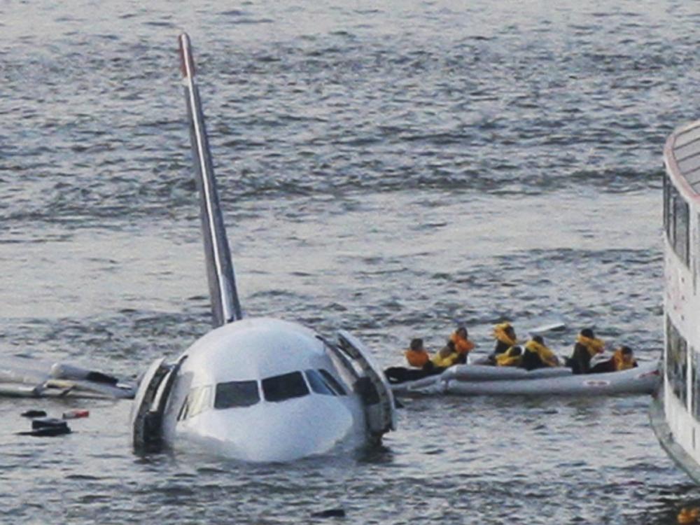 In this Jan. 15, 2009 file photo, passengers in an inflatable raft move away from US Airways Flight 1549 that went down in the Hudson River in New York. The passenger jet survived a bird strike and crash landing.