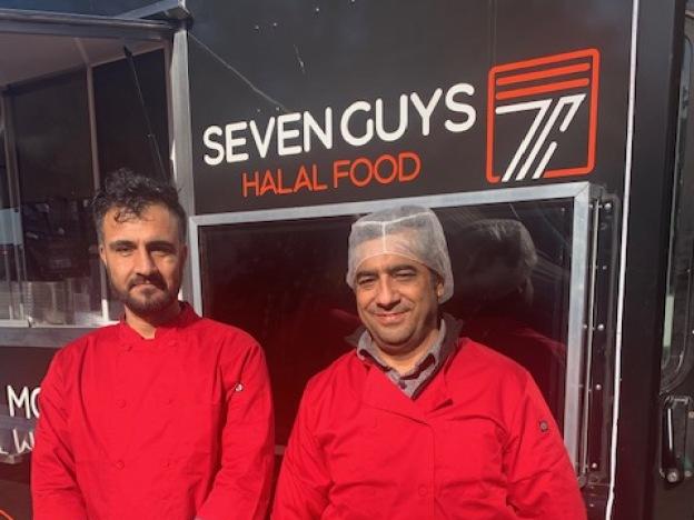 Shafi Amani (left) and his partner, Noor Agha, at their food truck near the King Street Metro in Alexandria, Va.