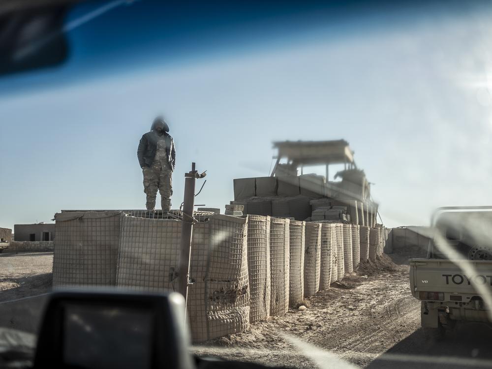 A Syrian Free Army soldier stands at the entrance of a base near the U.S. al-Tanf garrison in southern Syria, Dec. 14.