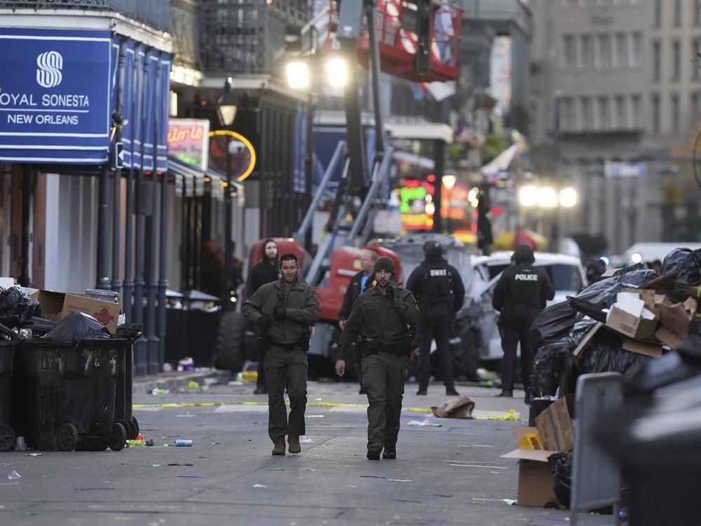 Emergency services attend the scene after a vehicle drove into a crowd on New Orleans' Canal and Bourbon Street.