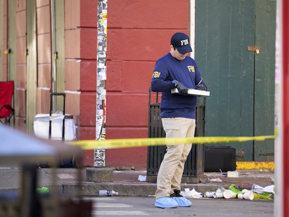 The FBI investigates the area on Orleans Street and Bourbon Street by St. Louis Cathedral in the French Quarter where a suspicious package was detonated after a person drove a truck into a crowd earlier on Bourbon Street.