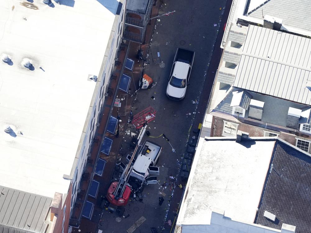 Investigators work the scene after a person drove a vehicle into a crowd earlier on Canal and Bourbon Street in New Orleans, Wednesday, Jan. 1, 2025.