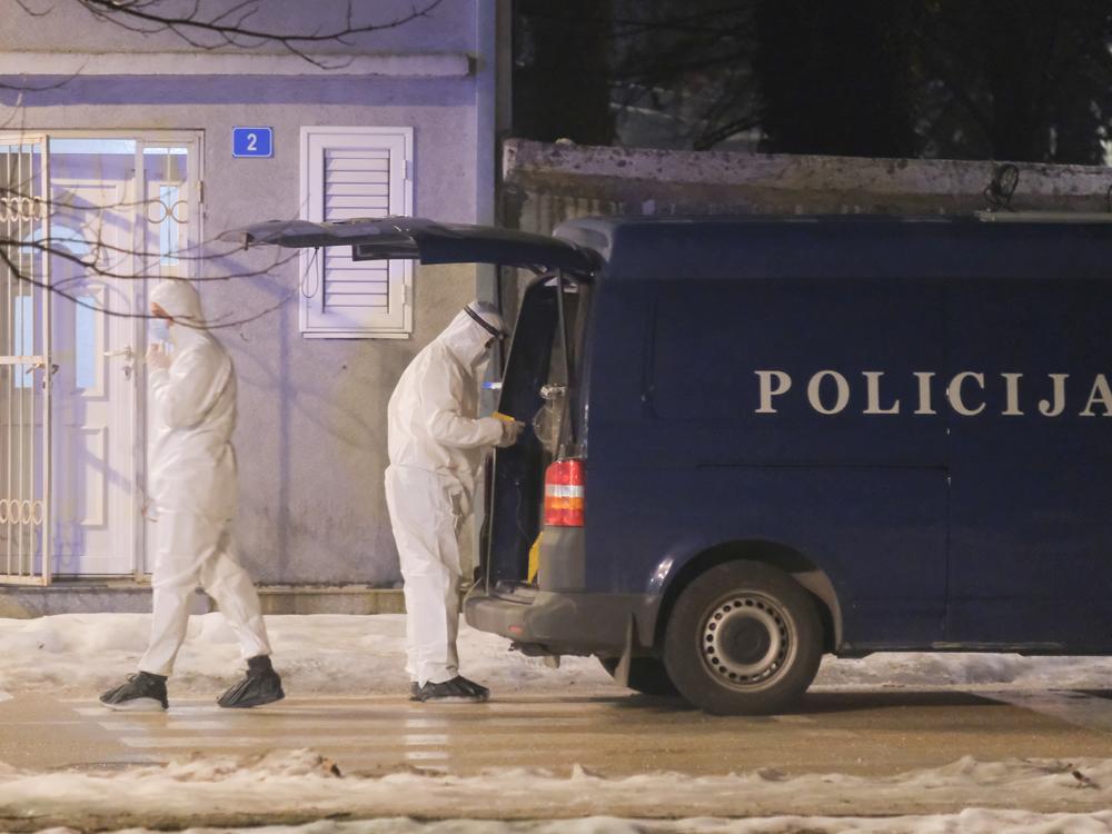 Police investigators work at the site of a shooting in Cetinje, located 22 miles west of Podogrica, Montenegro, Wednesday, Jan 1, 2025.