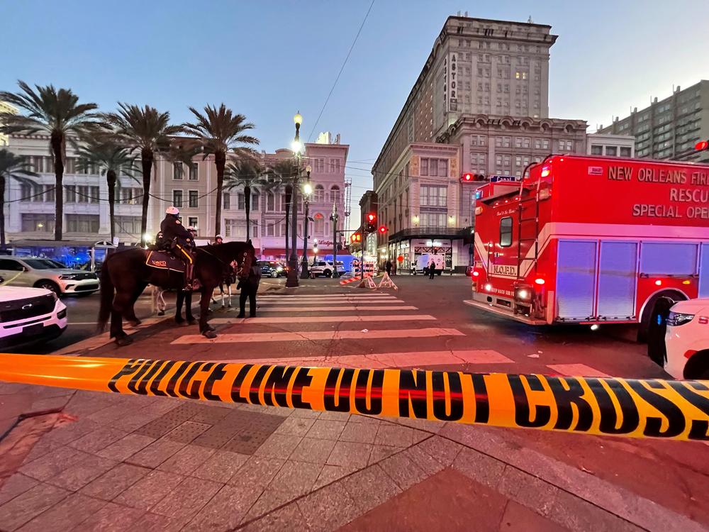 Police cordon off the intersection of Canal Street and Bourbon Street in New Orleans.