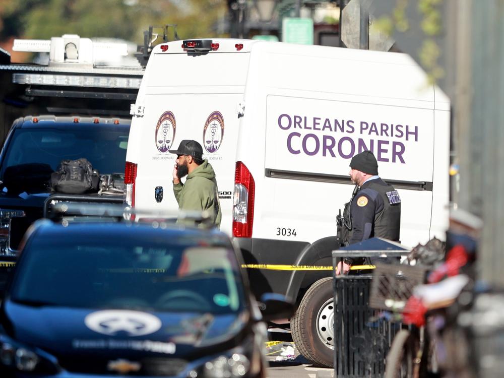 The Orleans Parish Coroner van returns to the scene on Bourbon Street.