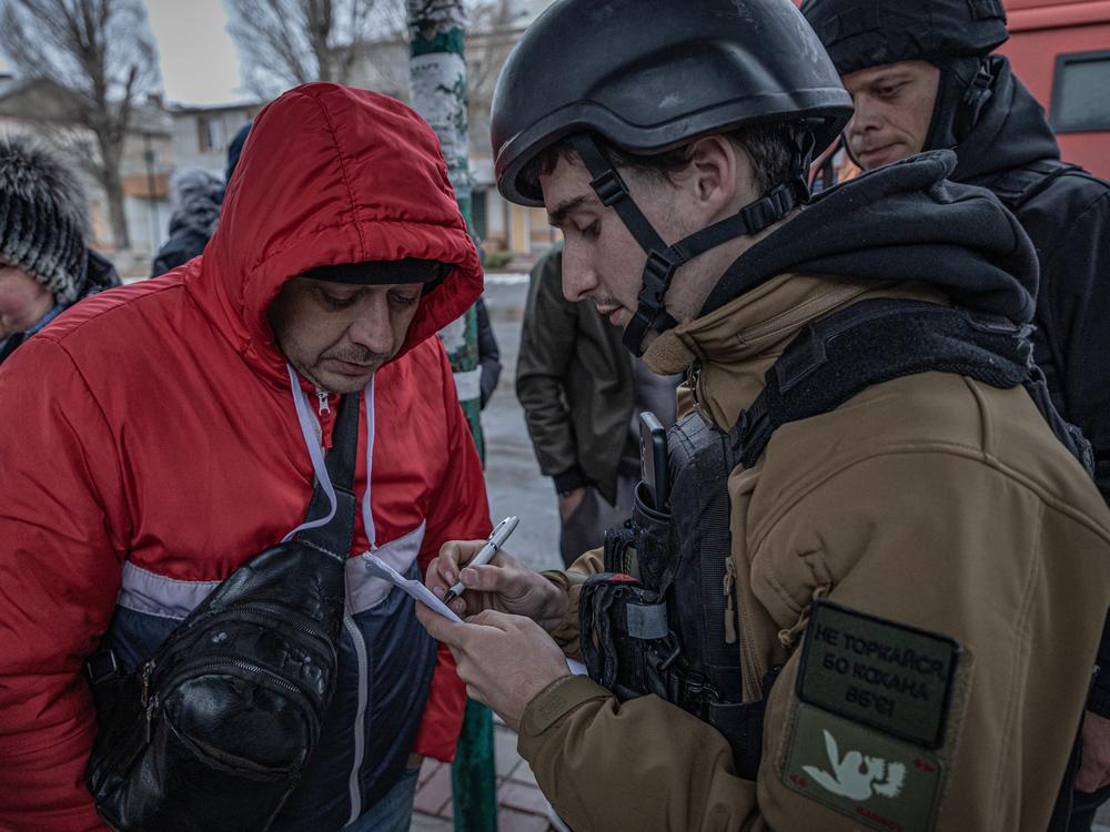 Danylo Reshetniak, 22, volunteers for a charity called Children New Generation. He registers people for evacuation from the city of Pokrovsk, where constant Russian bombardment has forced authorities to shut down electricity, gas and running water.