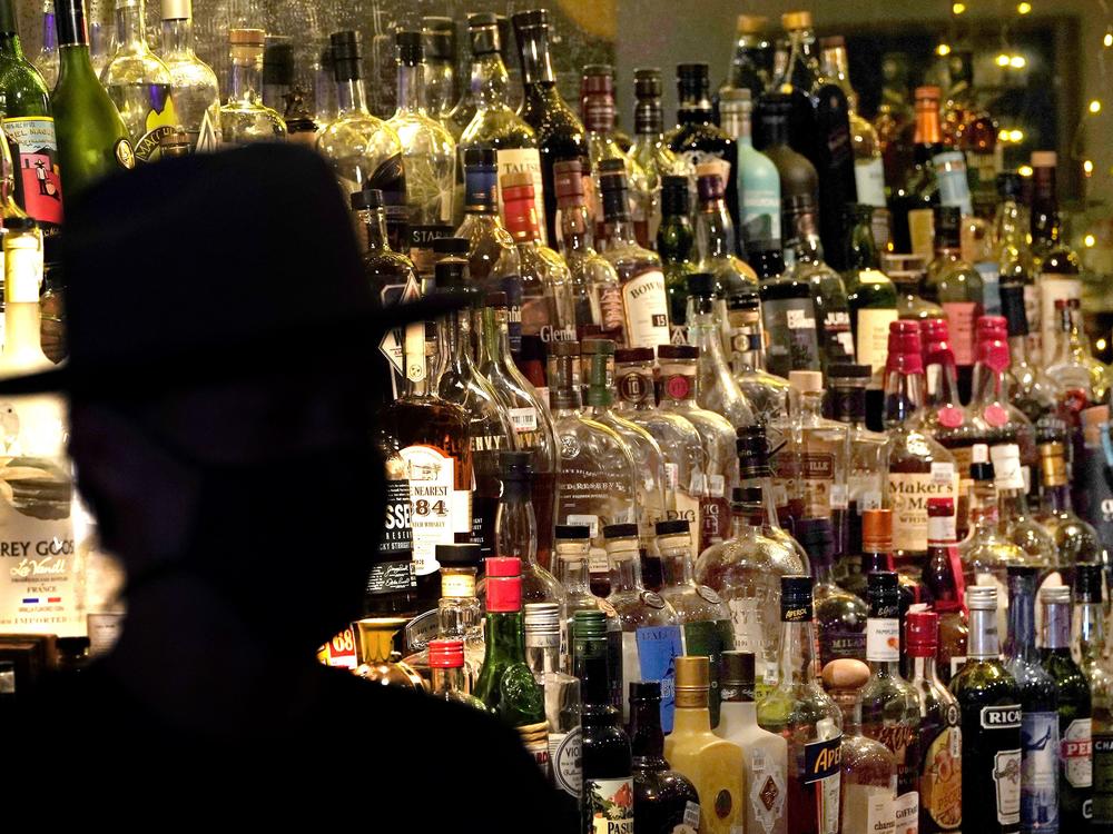 Bottles of alcohol sit on shelves at a bar in Houston on June 23, 2020.