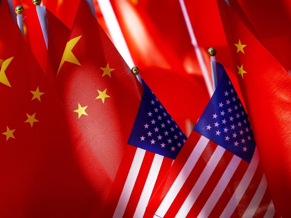 American flags are displayed with Chinese flags on top of a trishaw on Sept. 16, 2018, in Beijing.