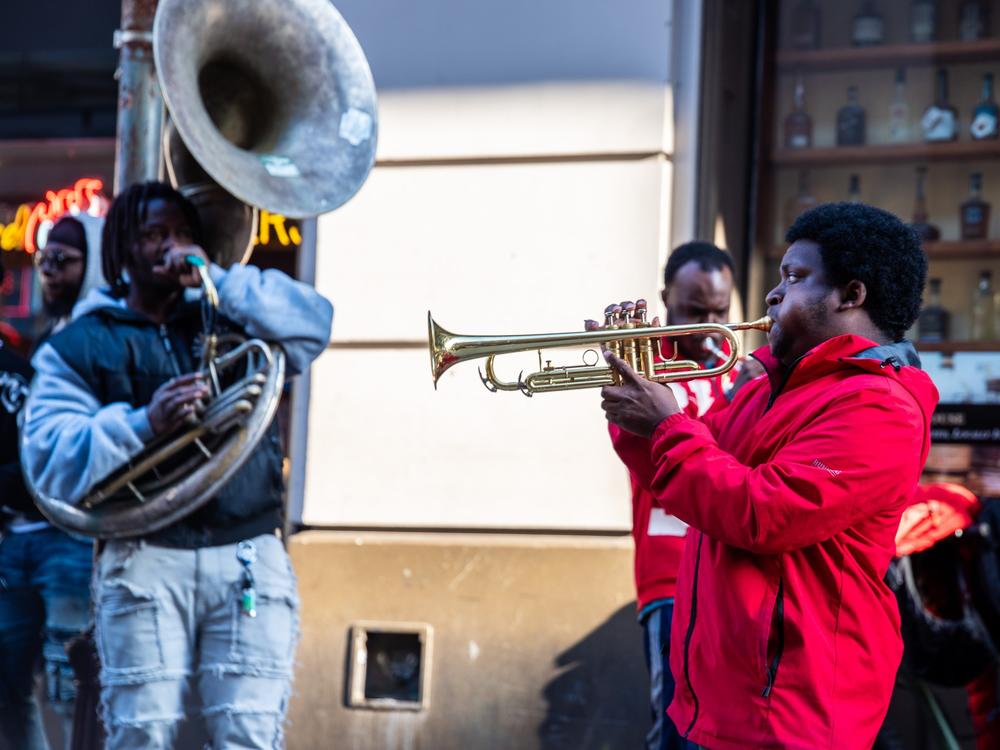 A member of the band said they were there to spread joy and entertain after the tragedy.⁠