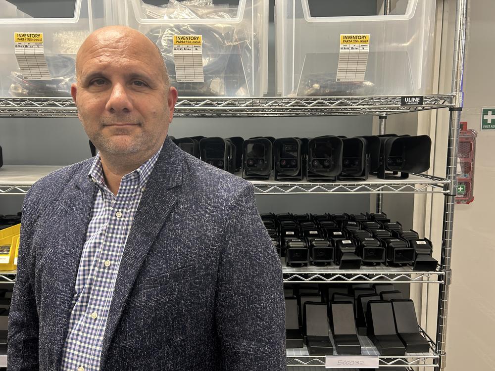 Charley Territo, Hayden AI's chief growth officer, stands in front of camera equipment at the company's offices in New Jersey.
