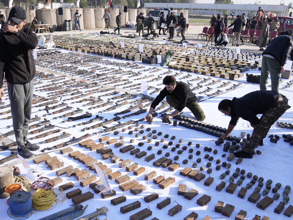 The Popular Mobilization Forces display weapons seized from ISIS in Salahuddin province, north of Baghdad, Iraq, in 2023.