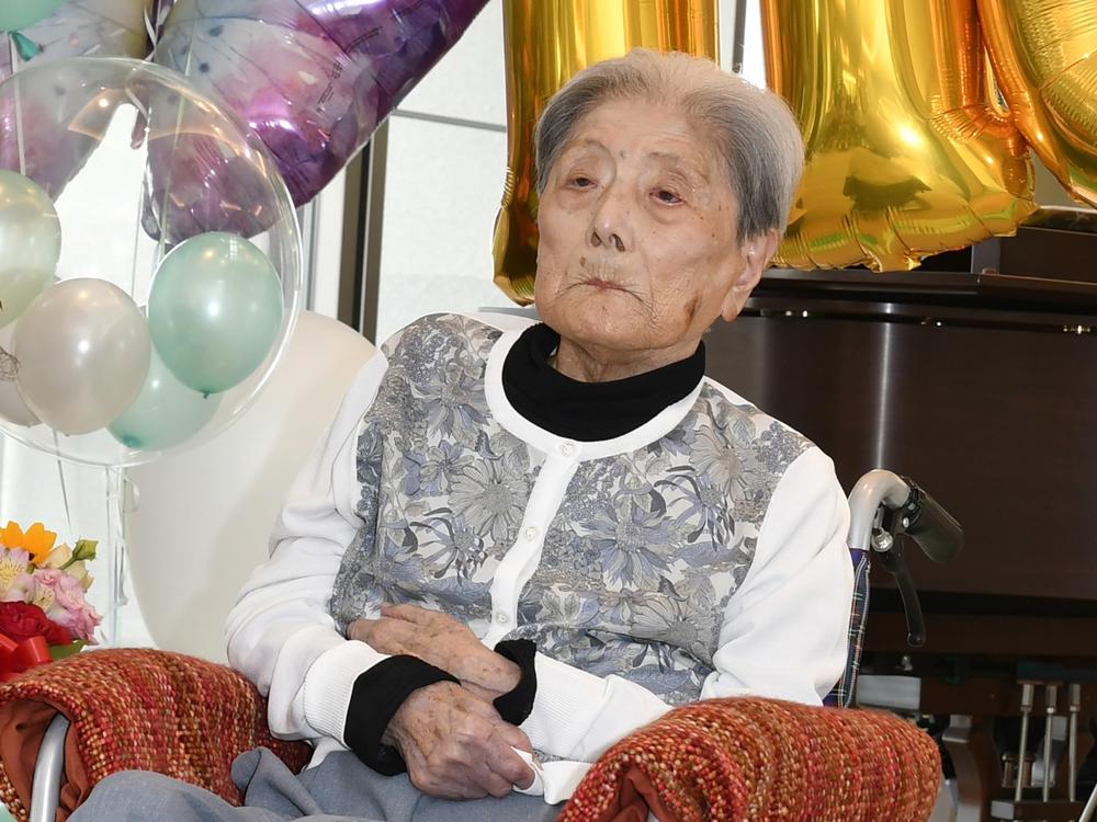 This photo provided by Ashiya City shows Tomiko Itooka, being celebrated for her 116th birthday at the nursing home she lives in Ashiya, western Japan, on May 23, 2024.
