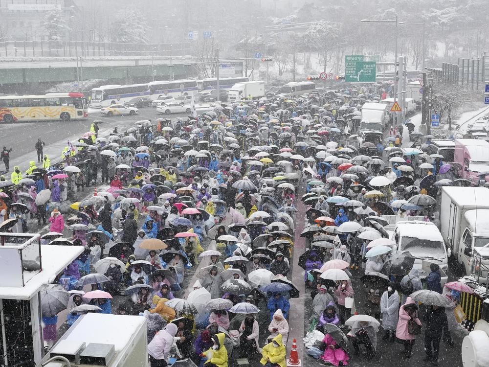 Supporters of impeached South Korean President Yoon Suk Yeol attend a Sunday service as they gather to oppose his impeachment near the presidential residence in Seoul, South Korea, on Sunday.