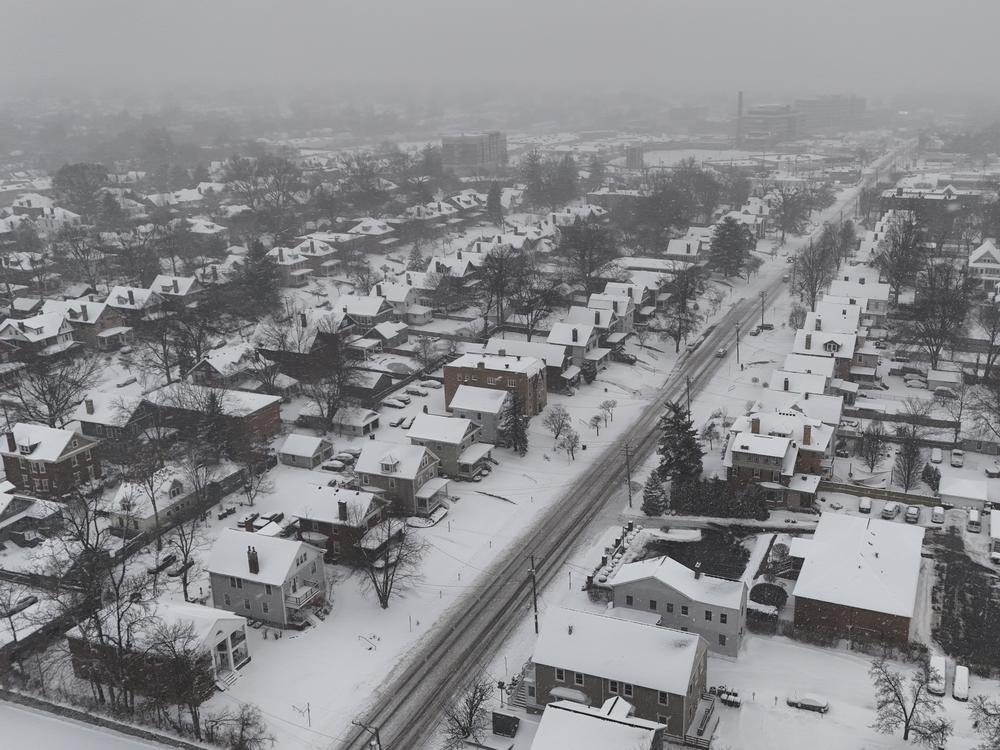 Snow covers homes during a winter storm, Monday, January 6, 2025, in Cincinnati, Ohio.