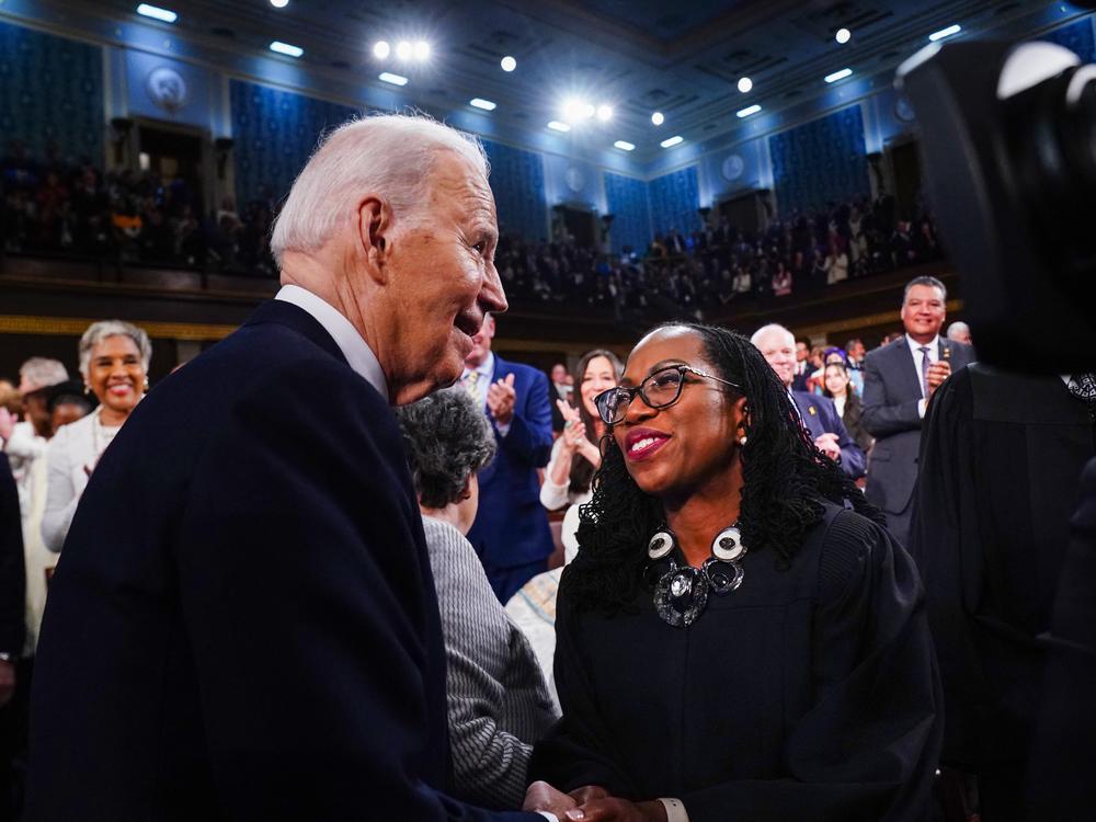 President Biden greets Supreme Court Associate Justice Ketanji Brown Jackson as he arrives to the House Chamber of the U.S. Capitol for his State of the Union address on March 7, 2024.
