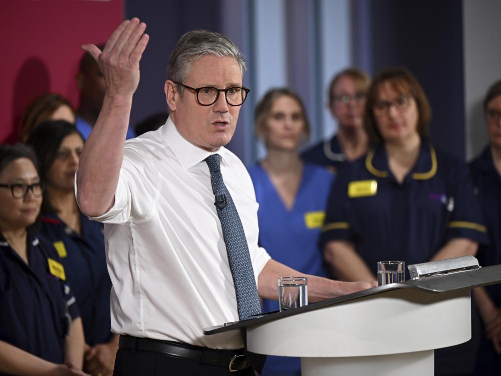 Britain's Prime Minister Keir Starmer gives a speech on reducing NHS wait times as he visits a health care provider in Surrey, England, Monday, Jan. 6, 2025.