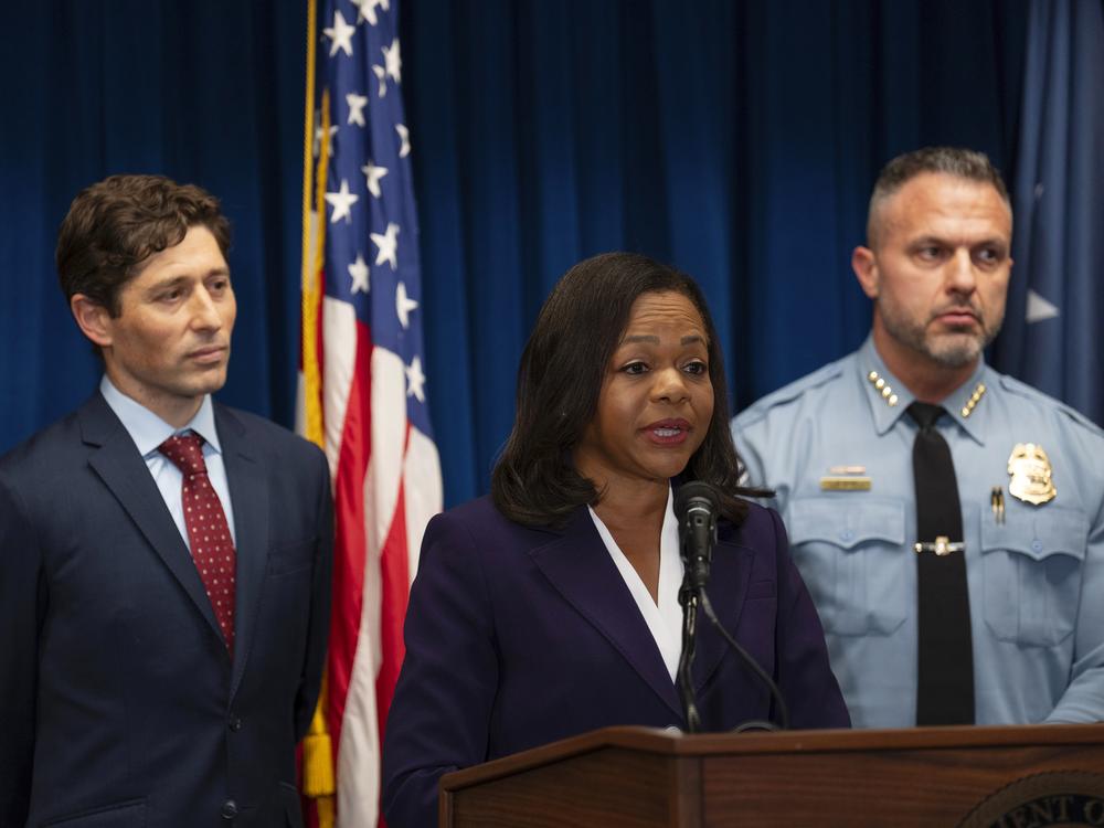 Assistant Attorney General Kristen Clarke of the Justice Department's Civil Rights Division, flanked by Minneapolis Mayor Jacob Frey, left, and Chief Brian O'Hara of the Minneapolis Police Department, speaks at a news conference at the U.S. Courthouse in Minneapolis, Monday, Jan. 6, 2025.