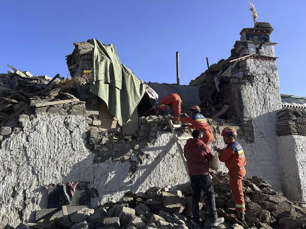 In this photo released by Xinhua News Agency, rescue workers search for survivors in the aftermath of an earthquake in Changsuo Township of Dingri in Xigaze, southwestern China's Tibet Autonomous Region on Jan. 7, 2025.