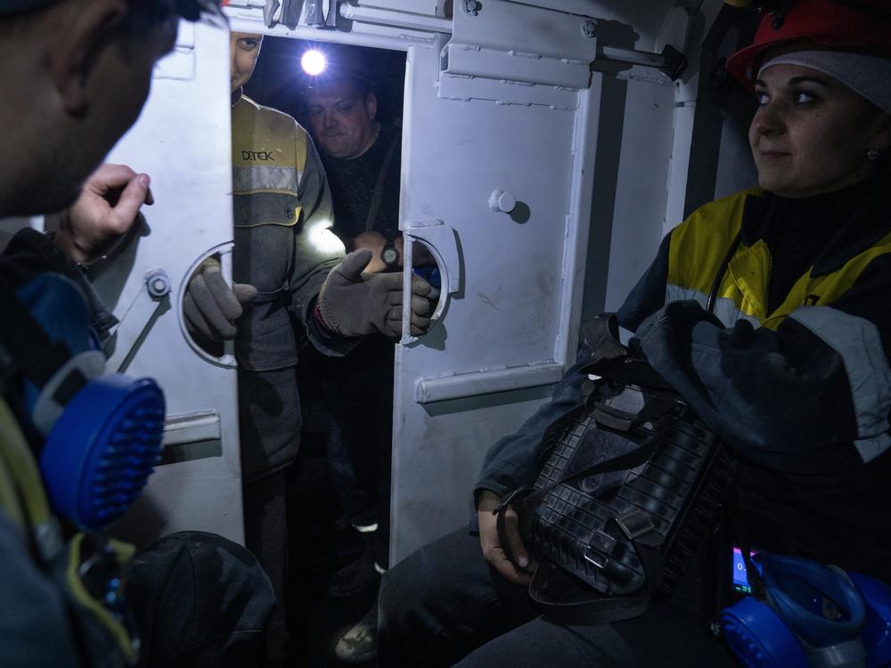 Iryna Ostanko rides a small train inside DTEK's coal mine in Ternivka, Ukraine. Ostanko is a coal miner's daughter and her husband also works underground at the same mine.
