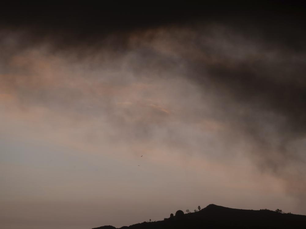 Smoke from wildfires hangs in the sky over Griffith Observatory on Jan. 8, 2025, in Los Angeles.