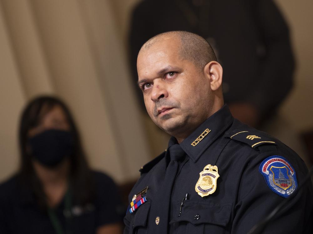 Capitol Police Sgt. Aquilino Gonell watches a video of rioters during a hearing of the House select committee investigating the Jan. 6 attack on the U.S. Capitol on July 27, 2021 in Washington, D.C.