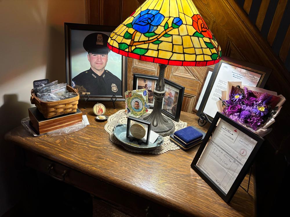 Awards, commendations and personal mementos for fallen Capitol Police Officer Brian Sicknick are set out on a table at his parents' house.
