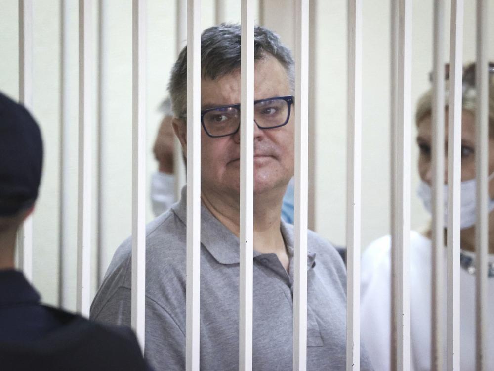 Viktar Babaryka, a former presidential hopeful, stands inside a defendants' cage during his trial in Minsk, Belarus, on July 6, 2021.