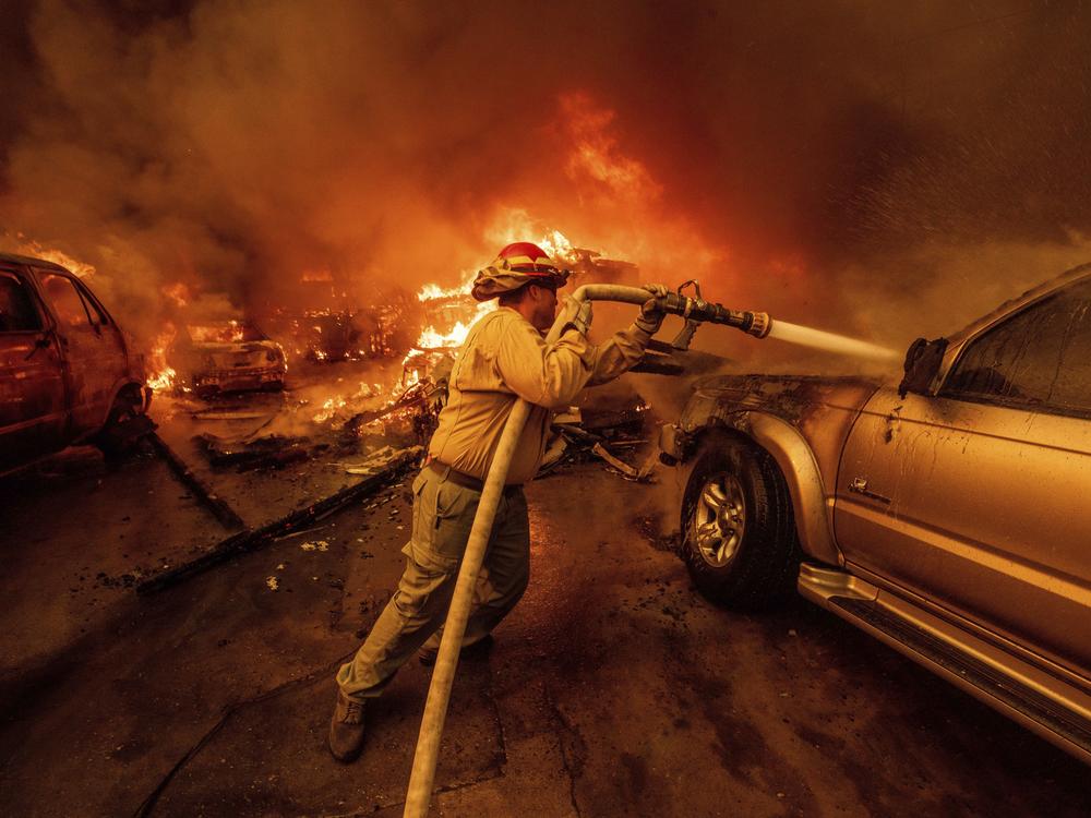 A firefighter battles the Eaton Fire on Wednesday, Jan. 8, in Altadena, Calif.