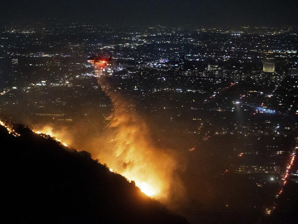 Wed., Jan. 8: Water is dropped by helicopter on the burning Sunset Fire in the Hollywood Hills section of Los Angeles.
