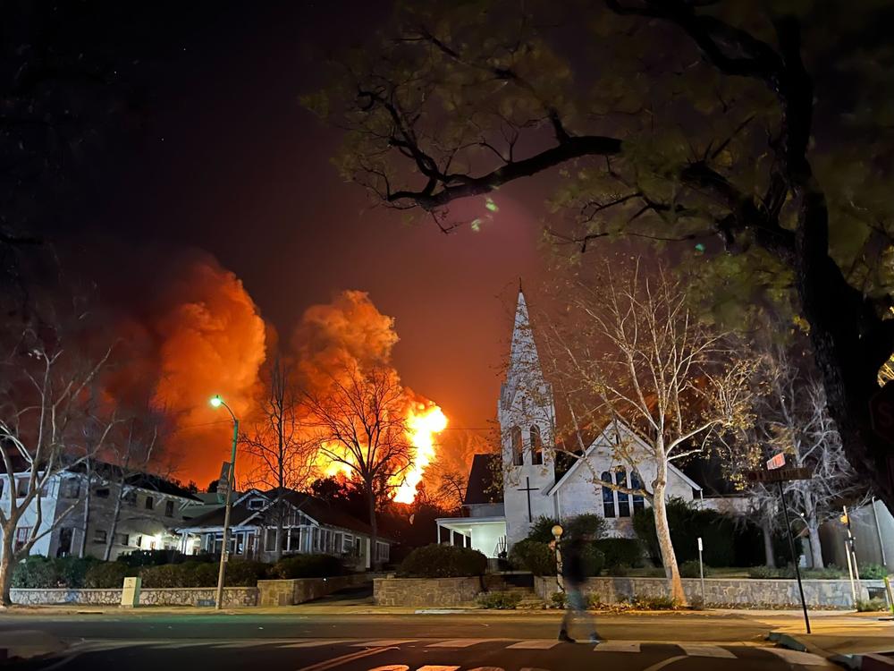 Fire and smoke visible in the city of Sierra Madre Tuesday night.