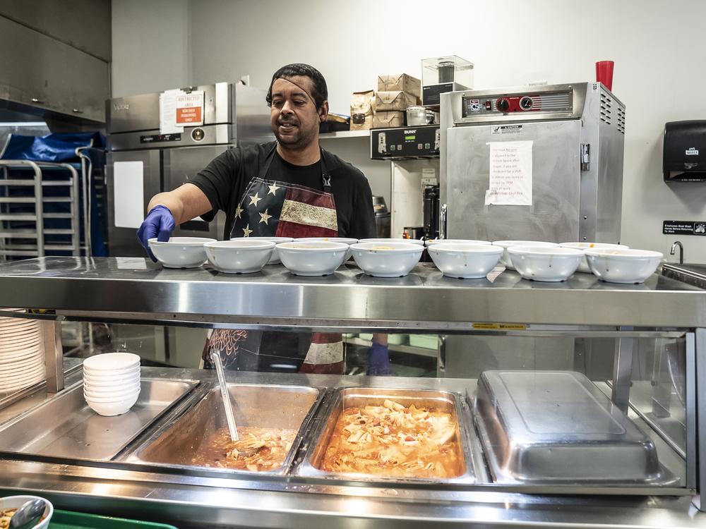 Hakim Tourougui serves soup made in-house at Central Union Mission.