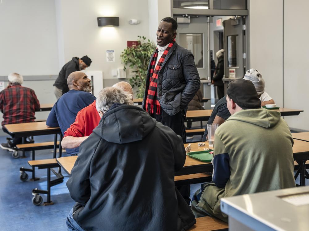 Ron Stanley Jr., a pastor who serves as the vice president of men's ministry, socializes with residents and supporters of Central Union Mission in Washington, D.C.