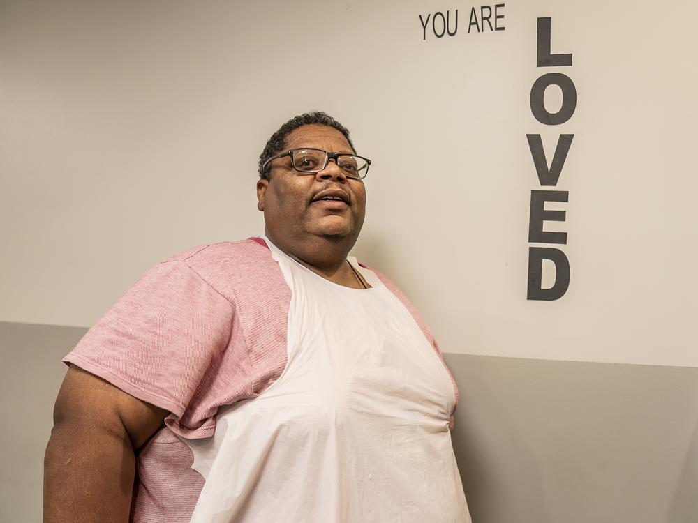 Willie Wiggins, who says he has been homeless for 18 months, volunteers in the mission's kitchen.