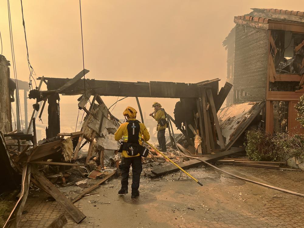Thurs., Jan. 9: Firefighters work to salvage a home that caught fire on the Pacific Coast Highway.