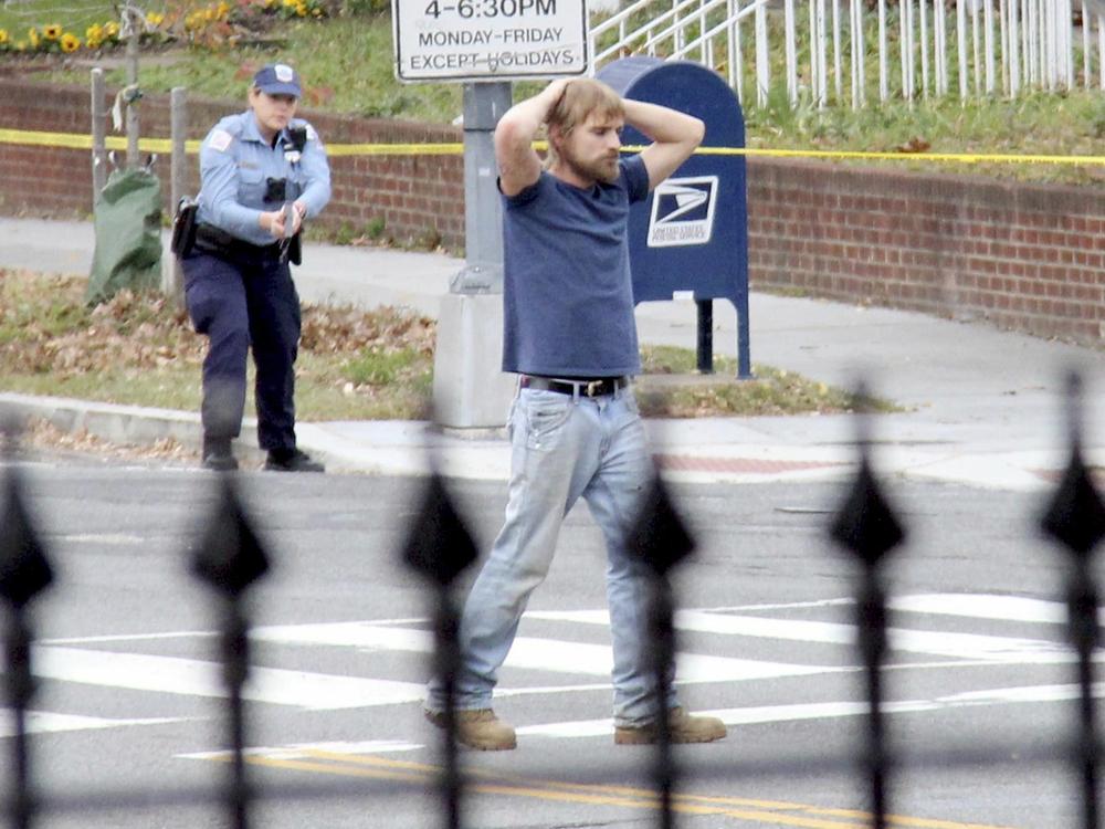 Edgar Maddison Welch, of Salisbury, N.C., is shown surrendering to police, in Washington, D.C., on Dec. 4, 2016.