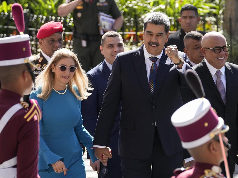 Venezuelan President Nicolas Maduro and his wife Cilia Flores arrive at the National Assembly for his swearing-in ceremony for a third term in Caracas, Venezuela, Friday, Jan. 10, 2025