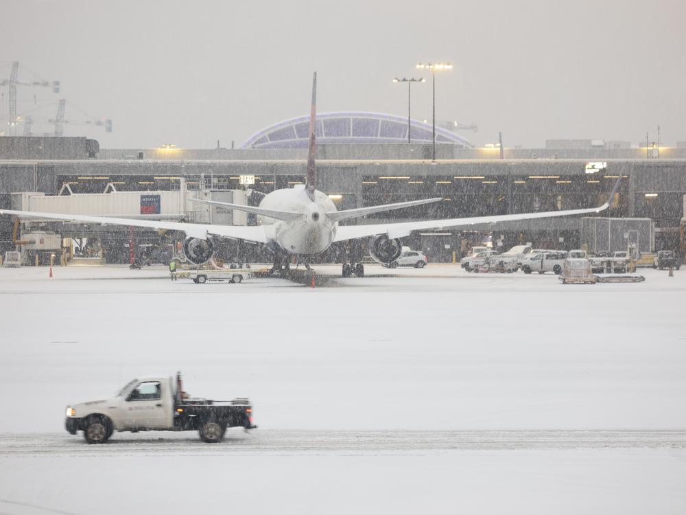 Snow blankets the Hartsfield-Jackson Atlanta International Airport on Friday as a winter storm moves into the Atlanta area.