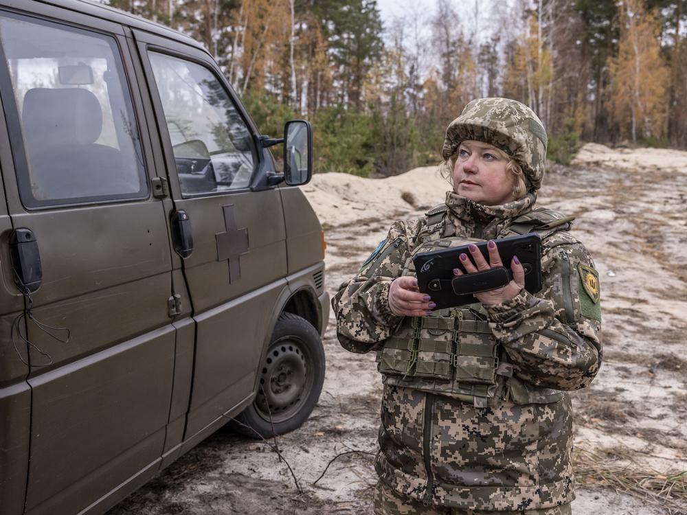 Valentyna, who trained as a veterinarian and has three sons, spends at least three days a week volunteering with the Combat Witches of Bucha. She uses a tablet to spot Russian drones.